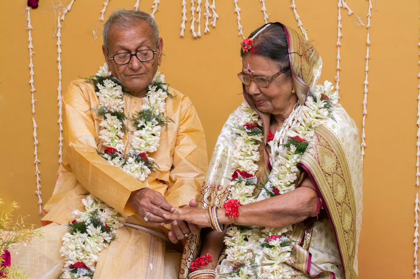 Elderly Indian men sitting together at a family gathering, frequent urination and prostate health
